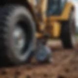 Backhoe tire pressure gauge in use