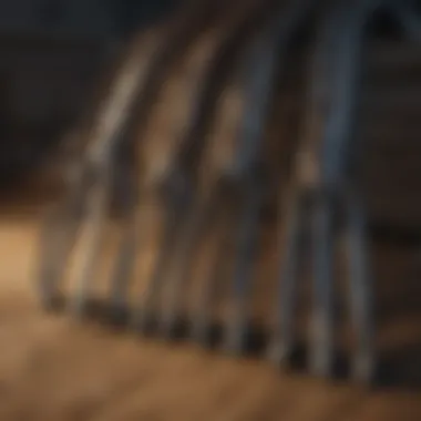 Different types of loader forks displayed on a wooden surface.