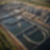 A wide view of a wastewater treatment plant showcasing various treatment stages.